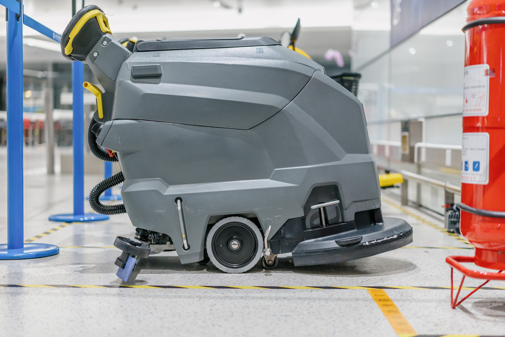 Worker,Cleaning,Floor,With,Machine